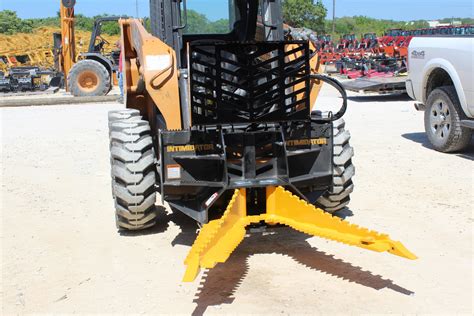 skid steer loader tree puller for sale|intimidator vs dominator tree puller.